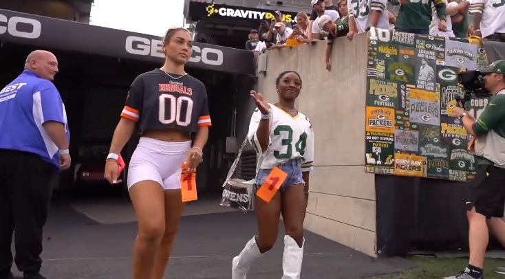 Simone Biles at Packers vs Bengals game, rocking Jonathan Owens jersey